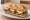 Bocadillo de Solomillo con Queso de Cabra: an illustration of pork, goat cheese and olive oil on baguette.