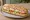 Bocadillo Vegetal: an illustration of tuna, egg, lettuce, tomato and more on baguette.