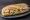 Bocadillo Vegetal con Pollo: an illustration of chicken, lettuce, tomato, onion and more on baguette.
