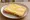 Boterham met Kaas: an illustration of butter and cheese on white bread.