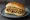 Boudin Sandwich: an illustration of rice and mustard on white bread.