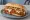 Breaded Steak Sandwich: an illustration of beef, marinara, giardiniera and mozzarella on hoagie roll.