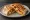 Breakfast Crunchwrap: an illustration of egg, bacon, cheese, hash browns and more on tortilla.