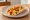 Breakfast Taco: an illustration of egg, bacon, potato, cheese and more on tortilla.