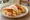 Breakfast Taco de Huevo con Frijoles: an illustration of egg, beans, cheese and salsa on tortilla.