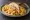 Breakfast Taco de Huevo con Papa: an illustration of egg, potato, cheese and salsa on tortilla.