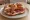 Brezel con Speck: an illustration of speck, pork and butter.