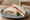 Brie and Grape: an illustration of brie and butter on white bread.