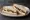 Brie and Grape: an illustration of brie and butter on white bread.