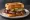 Brisket on Texas Toast: an illustration of beef, butter, pickle and onion on white bread.