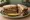 Brisket Sandwich (NYC Deli): an illustration of beef, horseradish, gravy, mustard and more on rye bread.
