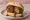 Broodje Bal: an illustration of beef and gravy on kaiser roll.