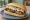 Broodje Bal Speciaal: an illustration of beef, mayonnaise and onion on kaiser roll.