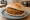 Broodje Bamischijf: an illustration of maggi seasoning sauce on kaiser roll.