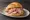 Broodje Beenham: an illustration of ham and mustard on kaiser roll.