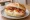 Broodje Ei met Bacon: an illustration of egg, bacon and butter on kaiser roll.