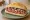 Broodje Filet Americain: an illustration of beef, mayonnaise, onion and caper on kaiser roll.