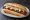 Broodje Frikandel Speciaal: an illustration of pork, beef, chicken, sausage and more on kaiser roll.