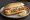 Broodje Gebakken Vis: an illustration of tartar sauce and lemon on kaiser roll.