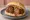 Broodje Gehaktbal: an illustration of beef, gravy and mustard on kaiser roll.
