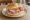 Broodje Gerookte Ham: an illustration of ham, butter and mustard on kaiser roll.