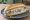 Broodje Haring met Uitjes: an illustration of herring and onion on kaiser roll.