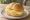 Broodje Kaas: an illustration of gouda, butter and mustard on kaiser roll.