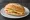 Broodje Kaas met Sambal: an illustration of gouda, sriracha and butter on kaiser roll.