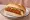 Broodje Kaaskroket: an illustration of cheese and mustard on kaiser roll.