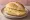 Broodje Komijnekaas: an illustration of cumin and butter on kaiser roll.