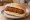 Broodje Kroket met Mosterd: an illustration of beef, béchamel and mustard on kaiser roll.
