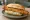 Broodje Lekkerbekje: an illustration of remoulade on kaiser roll.