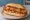 Broodje Loempia: an illustration of cabbage and carrot on kaiser roll.
