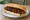 Broodje met Ketjap: an illustration of pork, beef and chicken on kaiser roll.