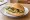 Broodje Mosselen: an illustration of butter and parsley on kaiser roll.