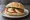 Broodje Mozzarella: an illustration of mozzarella, tomato, basil and olive oil on kaiser roll.
