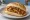 Broodje Nasi: an illustration of rice and sriracha on kaiser roll.