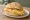 Broodje Omelet: an illustration of egg, butter and pepper on kaiser roll.