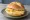 Broodje Oude Kaas: an illustration of gouda, butter and mustard on kaiser roll.