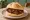 Broodje Rendang: an illustration of beef, pepper, lemongrass and ginger on kaiser roll.