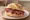 Broodje Rookvlees: an illustration of beef, butter and pepper on kaiser roll.