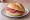 Broodje Salami: an illustration of salami and butter on kaiser roll.
