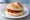 Broodje Sambal: an illustration of sriracha and butter on kaiser roll.