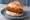 Broodje Satékroket: an illustration of pork and mustard on kaiser roll.