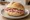 Broodje Schouderham: an illustration of ham, butter and mustard on kaiser roll.