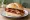 Broodje Spek: an illustration of bacon and butter on kaiser roll.