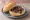Broodje Vlokken: an illustration of butter on kaiser roll.