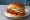 Buldak Chicken Sandwich (불닭): an illustration of chicken, gochujang, mayonnaise and lettuce on burger bun.