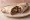 Burra: an illustration of beef, beans, cheese and onion on tortilla.