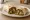 Burrito con Chile Verde New Mexico: an illustration of pork on tortilla.